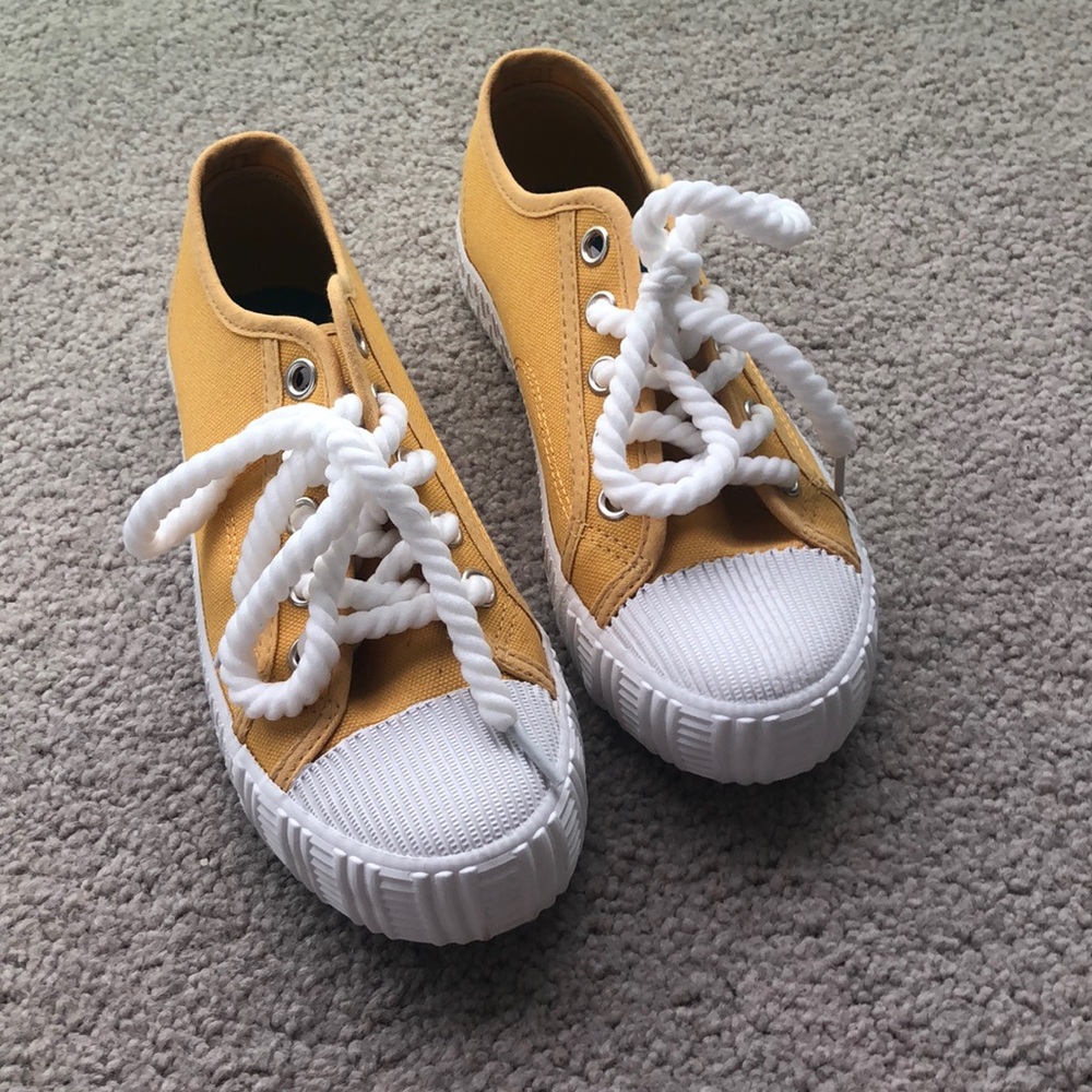 Yellow off brand converse